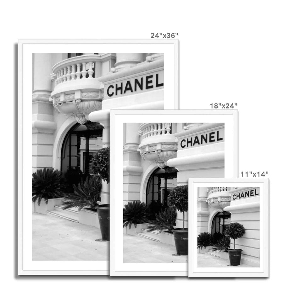 Chanel poster and adverts on the wall outside Maison Assouline